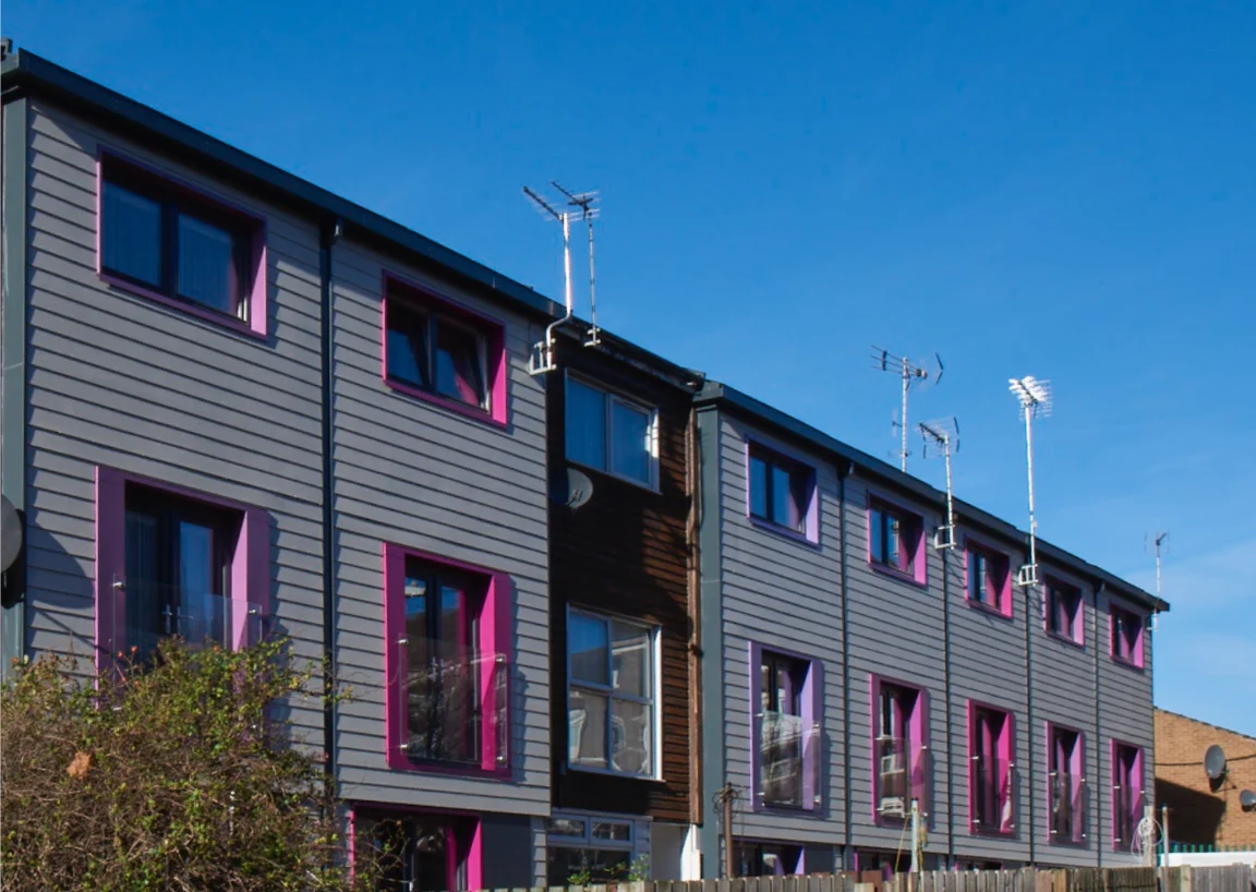 AFTER: Prefabricated wall panels installed on an existing multifamily building were designed to make the building energy-efficient, warm and desirable to tenants.